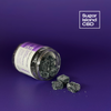 Sugar Island CBD REST cbd/hemp cbd oil/hemp oil infused gummies; dark purple gummies spilling out of tipped jar on purple background